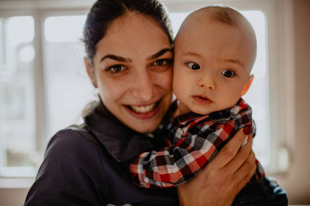 istock Mother holding beautiful baby boy 1145494394