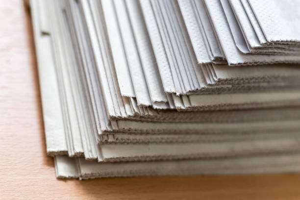 istock A stack of newspapers close-up. Lots of jagged paper sheets. 1145500776