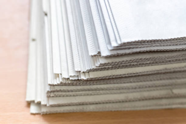 istock A stack of newspapers close-up. Lots of jagged paper sheets. 1145500794