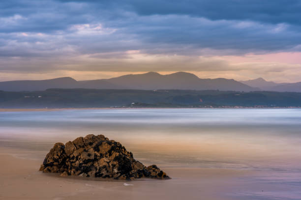 istock Plettenberg Bay beach at sunset, with hills in the distance 1145503385