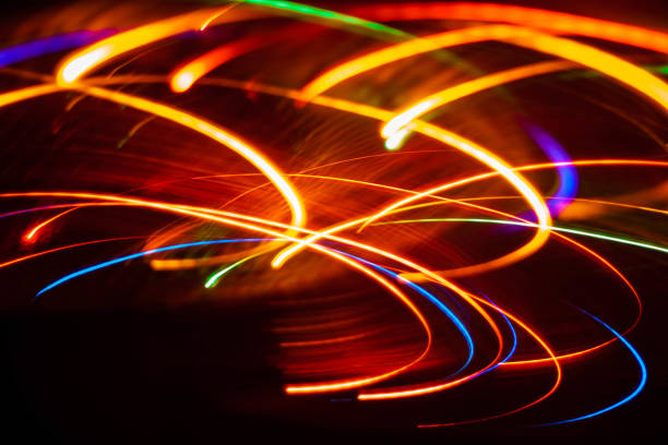 istock Color light stripes on a black background 1145504430