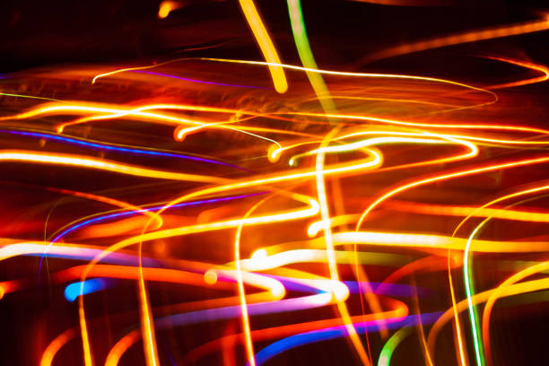 istock Color light stripes on a black background 1145504431