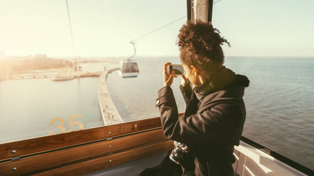 Tourist girl in cableway car