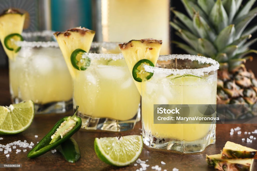 Alcoholic cocktail Pineapple Margarita, tequila with lime and jalapeno Cocktail Stock Photo