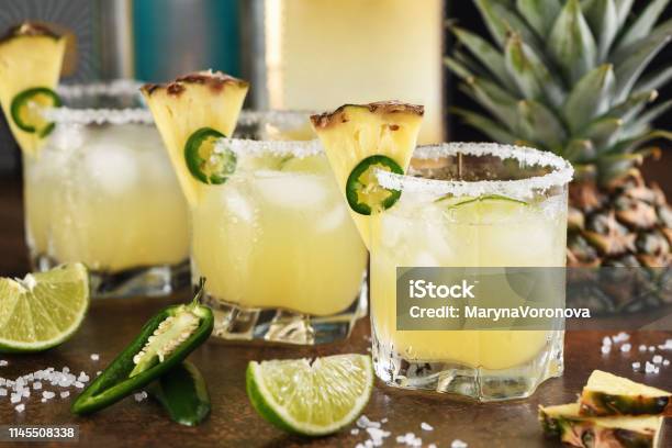 Alcoholic Cocktail Pineapple Margarita Tequila With Lime And Jalapeno Stock Photo - Download Image Now