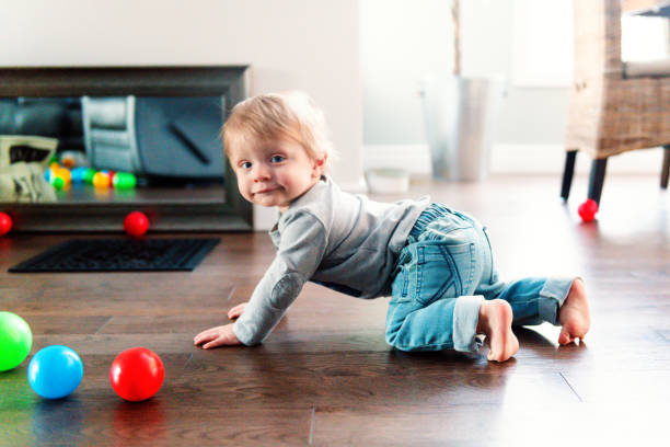 istock Parents Watching Baby Son Take First Steps At Home 1145511293