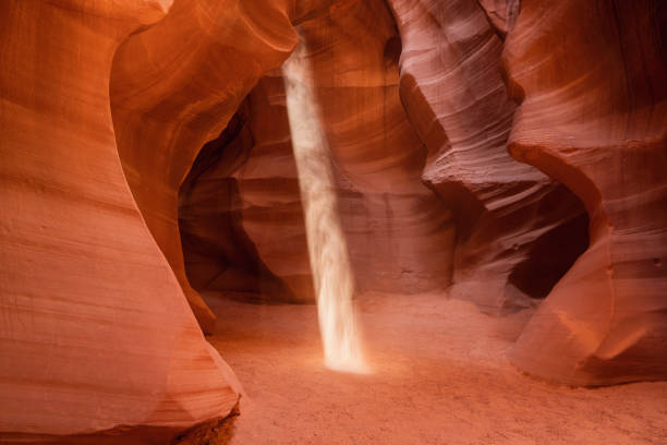 Antelope Canyon Sunbeam in Page Arizona USA Sunbeam spot inside the amazing colorful and famous Antelope Canyon, Rock Textures and Shades in the early morning light. Page, Arizona, USA upper antelope canyon stock pictures, royalty-free photos & images