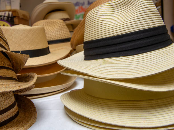 istock Stacks of straw hats 1145520009