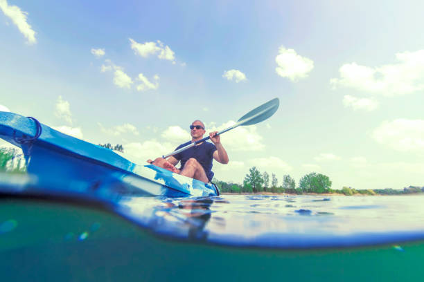 istock Young Man Kayaking on Lake, Kayaking Underwater View, Split Shot. 1145523996