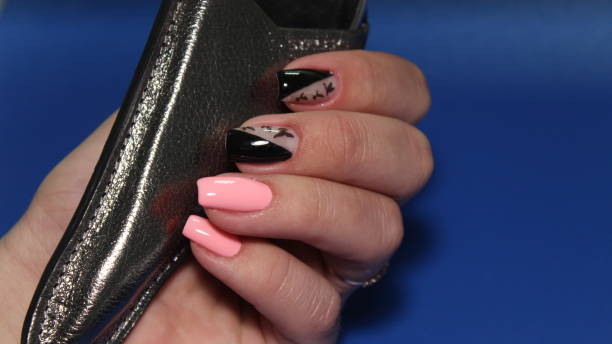 istock stylish design of manicure on long beautiful nails 1145524717