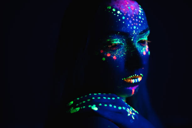 istock Young woman with fluorescent makeup 1145526450