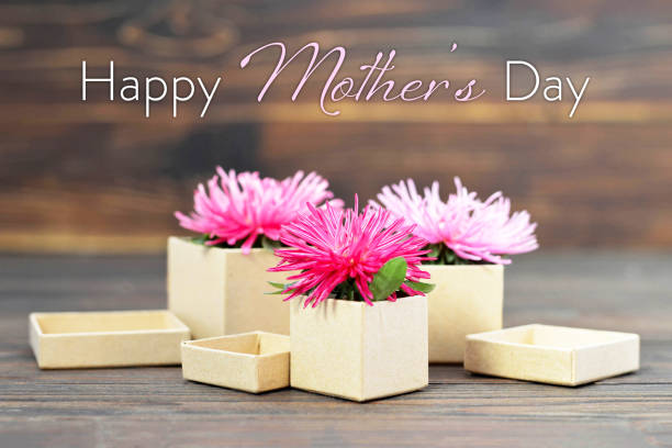istock Happy Mothers Day card with gift boxes and flowers 1145526457