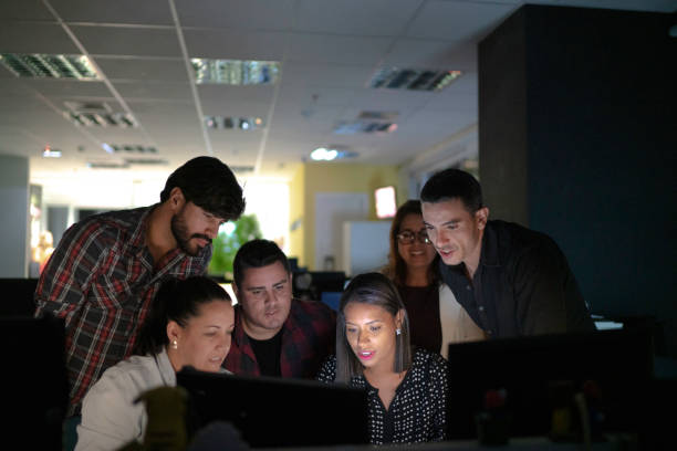 istock Dedicated team reunited working late at office 1145526542