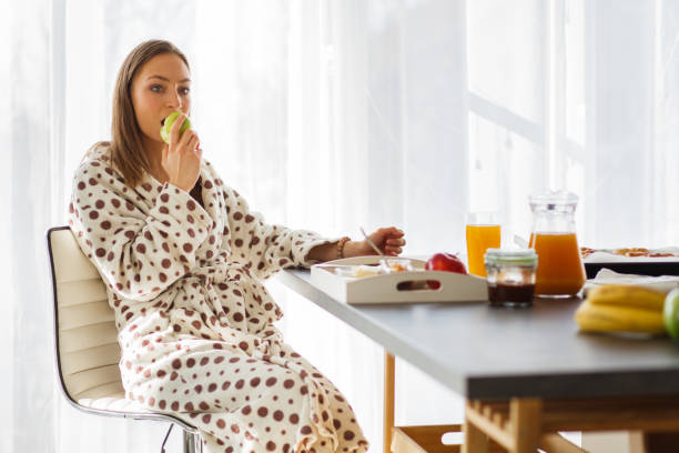 istock Young woman having a breakfast 1145533374