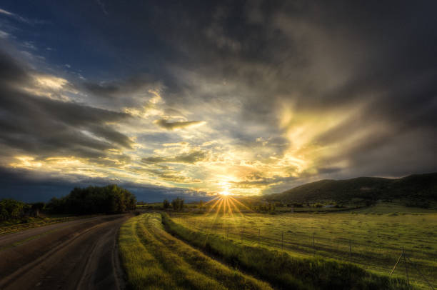 Sunset in a cloudy sky of an idyllic landscape