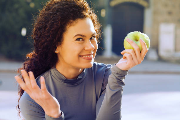 istock Young woman eating an apple 1145549865