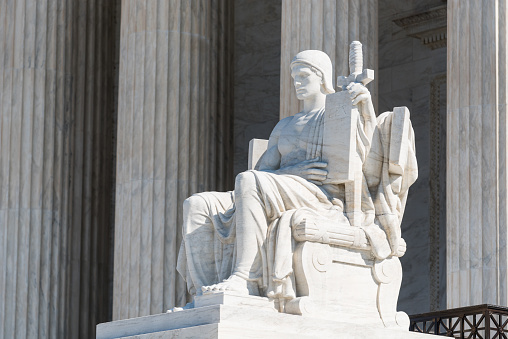 The Guardian or Authority of Law statue sitting outside of Supreme Court of the United States on First Street in Washington DC, USA