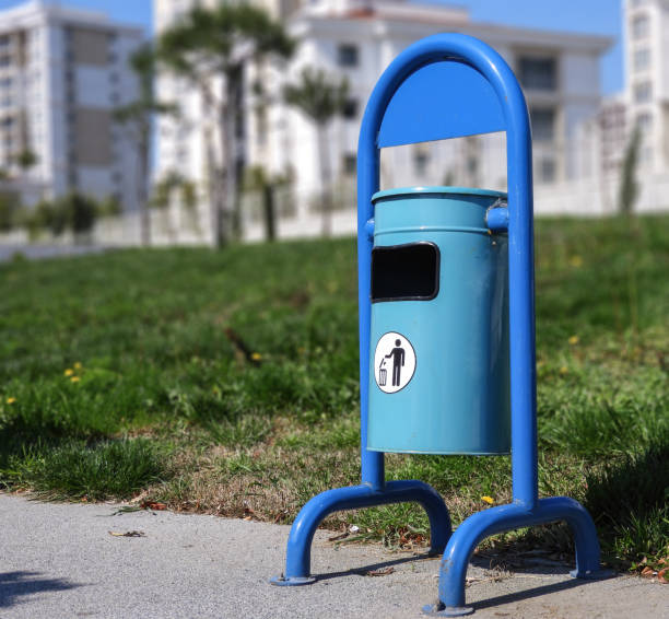 istock blue trash can in the city park 1145554658