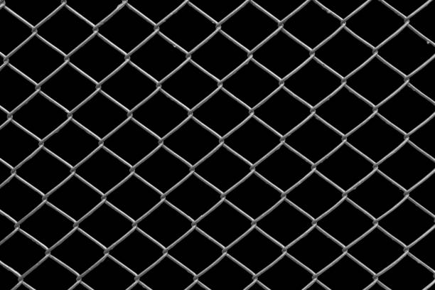 istock chain link fence with black background 1145560457