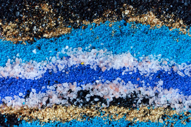 istock Layered colorful sand pattern. Marble style background. Blue and gold powder texture. 1145564975