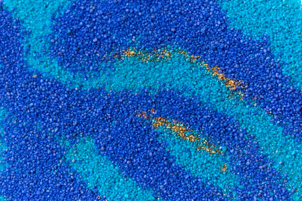 istock Layered colorful sand pattern. Marble style background. Blue and gold powder texture. 1145565041