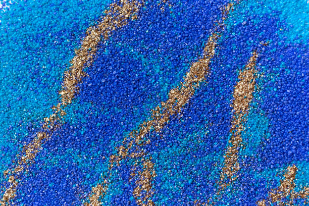 istock Layered colorful sand pattern. Marble style background. Blue and gold powder texture. 1145565069