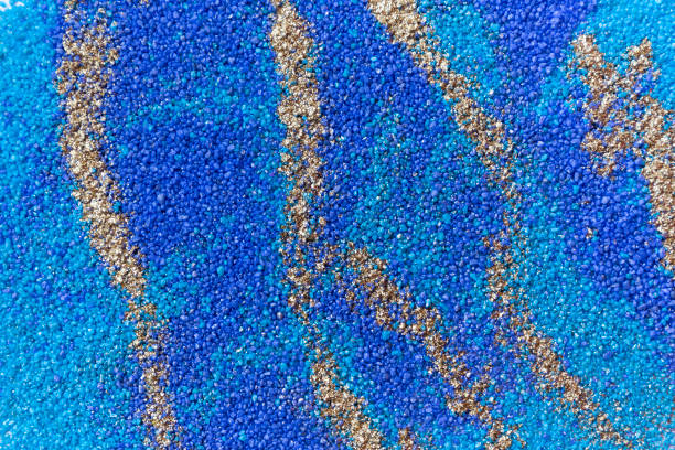 istock Layered colorful sand pattern. Marble style background. Blue and gold powder texture. 1145565080