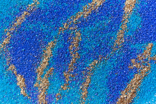 istock Layered colorful sand pattern. Marble style background. Blue and gold powder texture. 1145565108