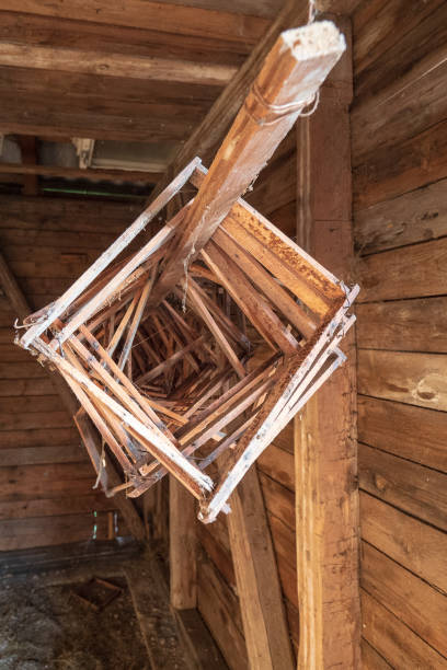 wooden honeycomb frames hanging from the ceiling inside an old log cabin in the salzkammergut region, oö, austria - home interior cabin shack european alps imagens e fotografias de stock