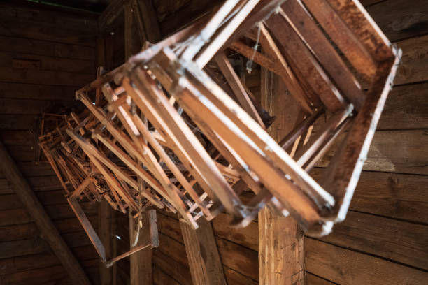 wooden honeycomb frames hanging from the ceiling inside an old log cabin in the salzkammergut region, oö, austria - home interior cabin shack european alps imagens e fotografias de stock