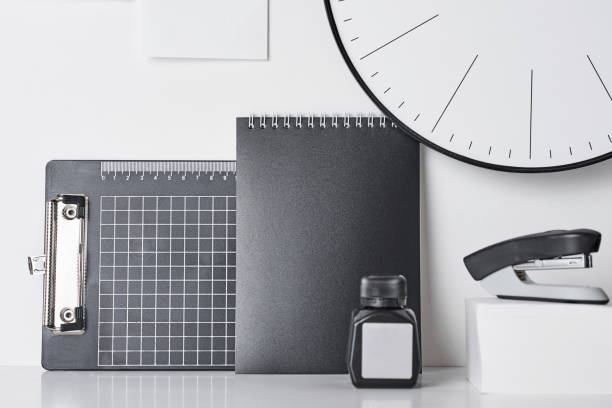 istock Office supplies, sticky and round clock on white 1145573795