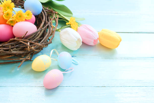 istock Colorful Easter eggs in nest with flowers 1145580926
