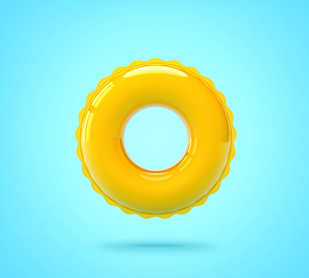 anillo de natación amarillo sobre fondo azul - inflable fotografías e imágenes de stock