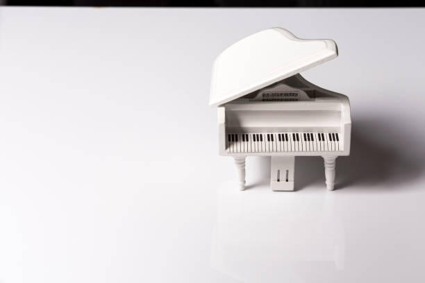 istock White tiny toy piano music sound on a white background 1145581505