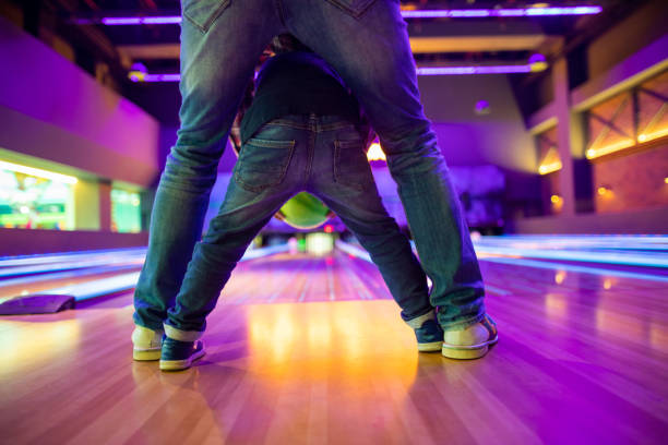 istock Father and son at bowling alley 1145584392