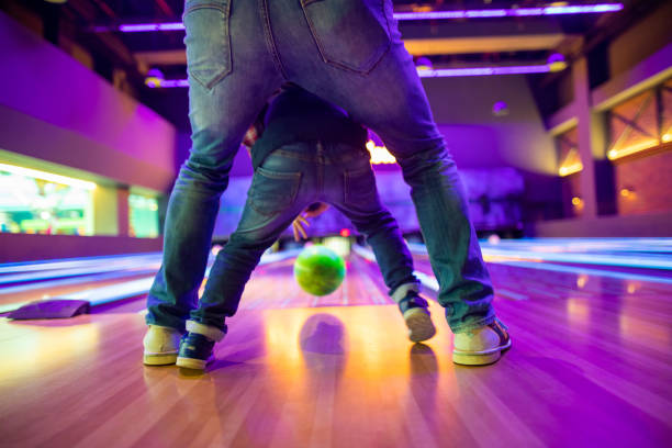 istock Father and son at bowling alley 1145584509