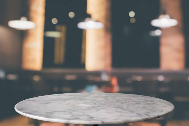 istock round marble table top with cafe restaurant bokeh lights abstract background for montage product display 1145584683