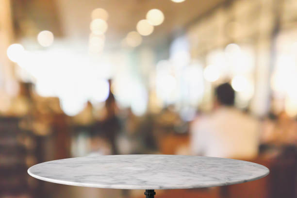 istock round marble table top with cafe restaurant bokeh lights abstract background for montage product display 1145584685