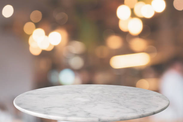 istock round marble table top with cafe restaurant bokeh lights abstract background for montage product display 1145584688
