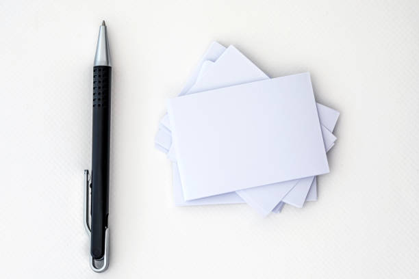 istock stacking of mockup empty white business card with elegance pen  on a white paper background ,a template for business  branding identity design 1145585782