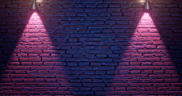 istock 3d rendering. Brick wall illuminated by neon pink light from spotlights. Abstract background Light effect on a serving surface. 1145590978