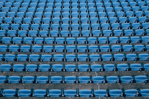 Aerial view of blue stadium seats.