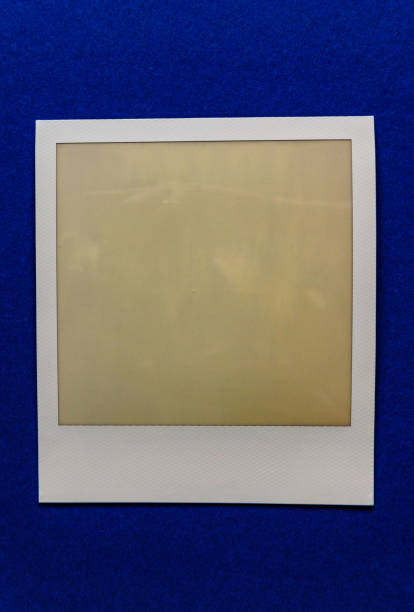 istock old empty instant film frame on real paper background 1145594347