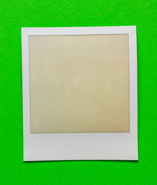 istock old empty instant film frame on real paper background 1145594348