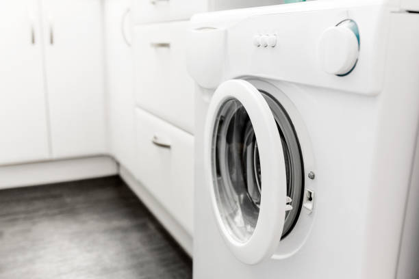 washing machine built in the interior of a modern small kitchen