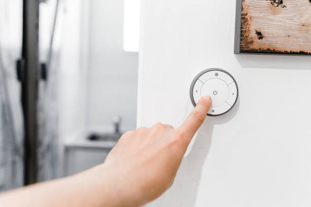 istock Male hand press button of moderm switch control in hotel room 1145595033