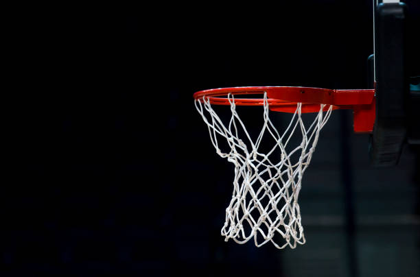 istock Low Angle View Of Basketball Hoop At Night 1145599246