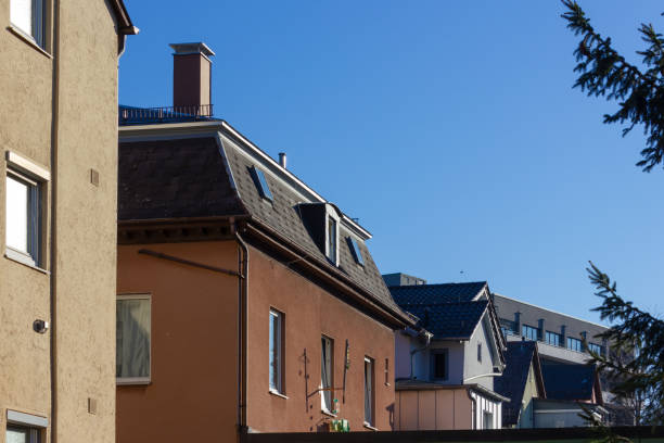 istock city house rooftops with chimney and antenna 1145599268