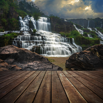 Wooden floor and beautiful landscape at sunset.