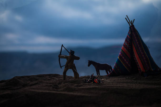 Artwork decoration creative concept. An old native american teepee in desert at the evening. Wigwam house indian style.